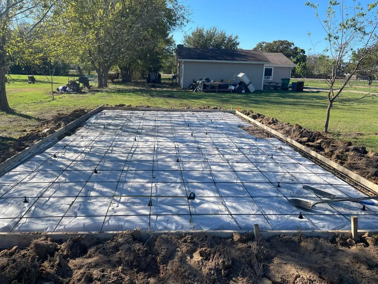 Slab prep with rebar and a plastic vapor barrier