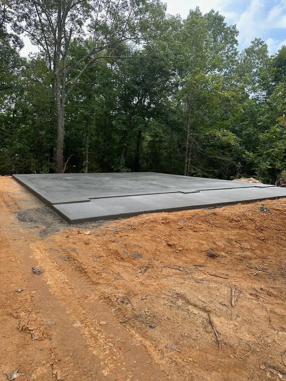 Concrete slab foundation on a cleared dirt pad