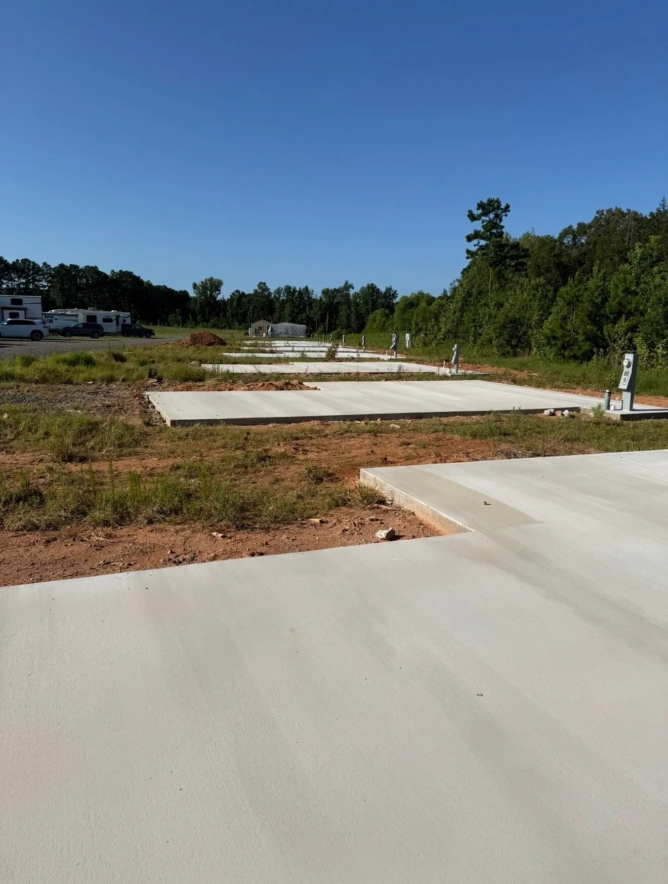 Concrete slabs poured on a cleared rural lot